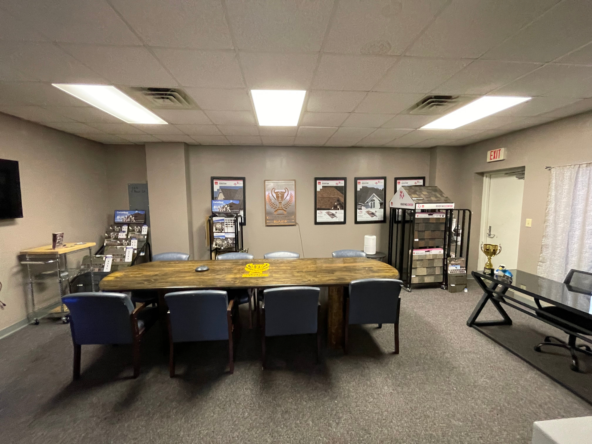 Carolina Trophy Roofs office interior with roofing materials and displays
