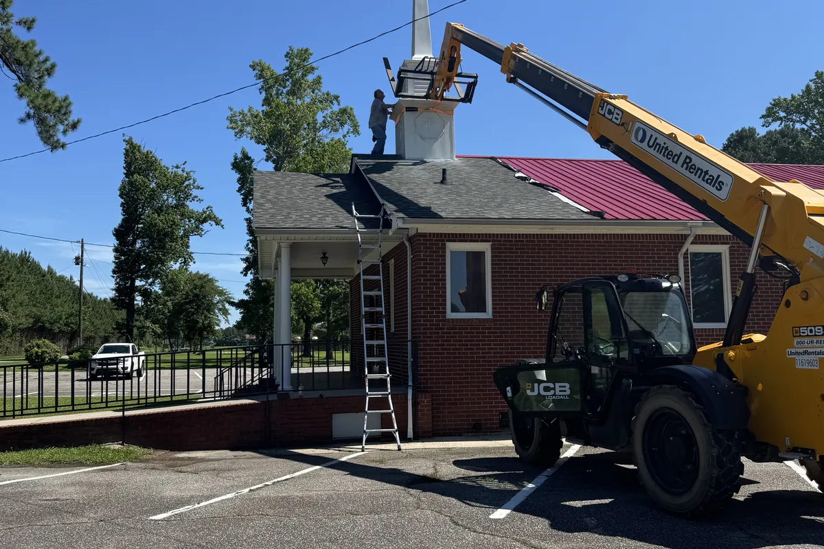 Boom crane on site for church steeple work