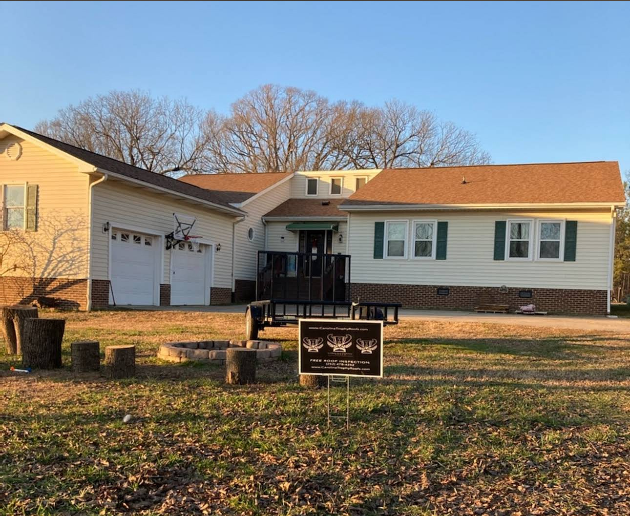 Carolina Trophy Roofs completed project with company sign